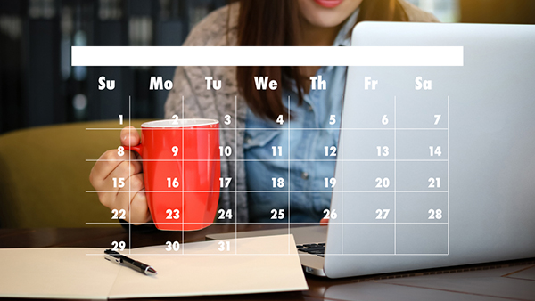 Calander dates graphic imposed over a woman working on her laptop.