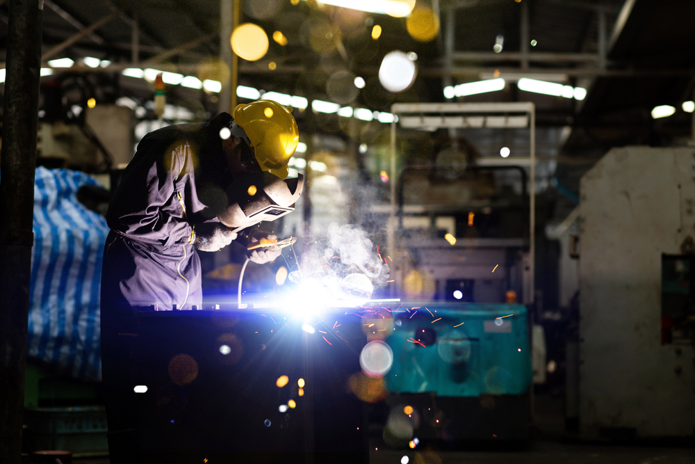 A Man following all safety procedures whilst welding professionally.